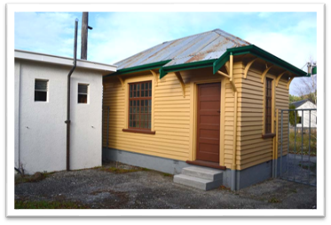 A small yellow house

Description automatically generated with medium confidence