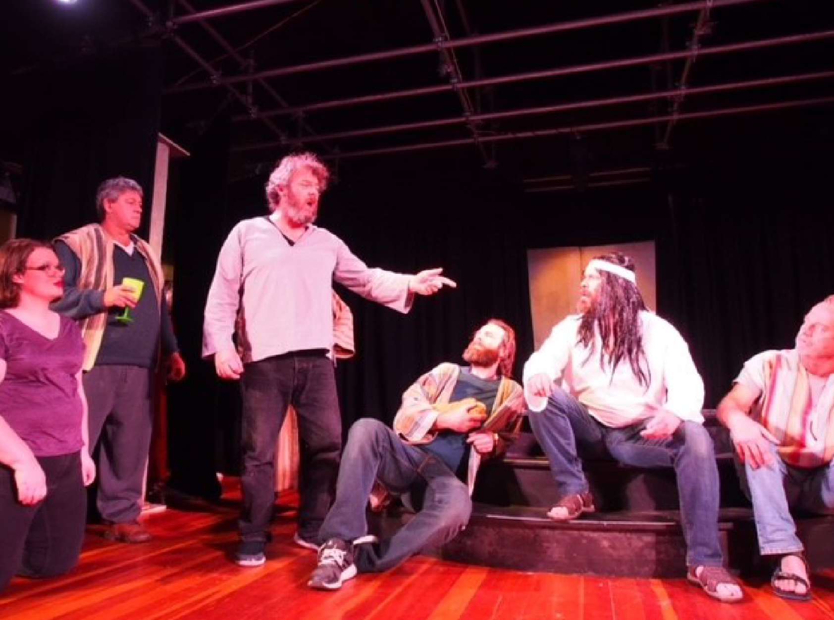 A group of people on a stage

Description automatically generated