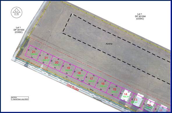 A aerial view of a parking lot

Description automatically generated