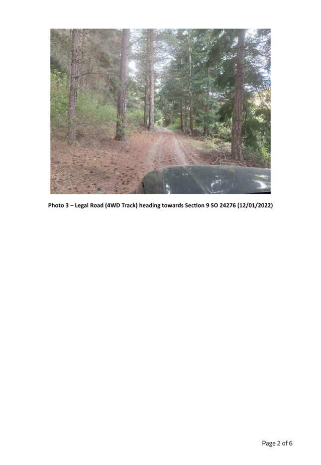 A car parked on a dirt road

Description automatically generated