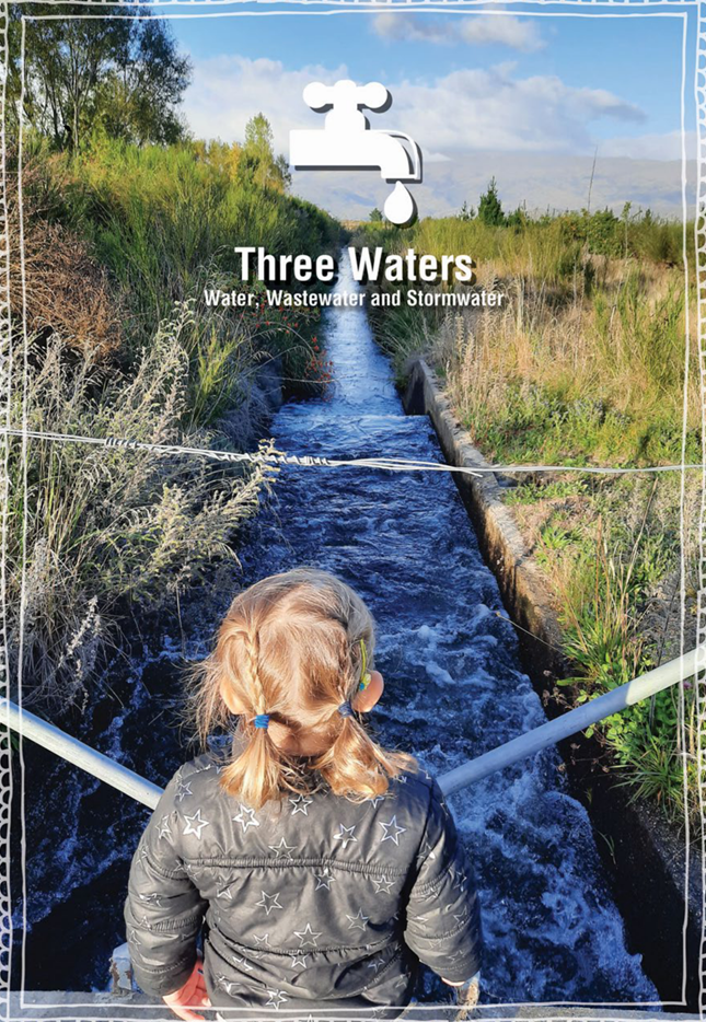 A child standing in a river

Description automatically generated
