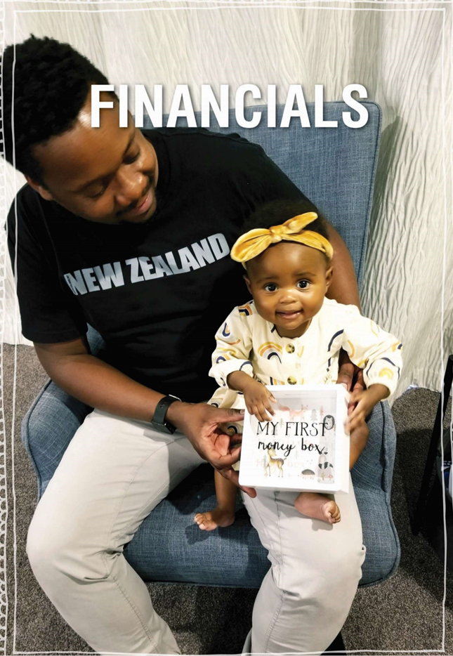 A person holding a baby

Description automatically generated