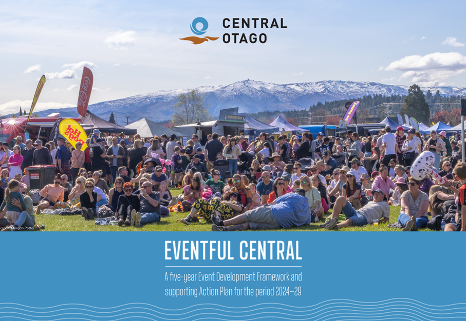 A large group of people sitting on the grass

Description automatically generated