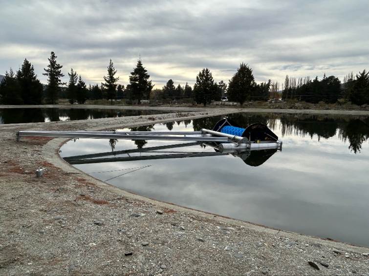 A water body with a metal structure

AI-generated content may be incorrect.